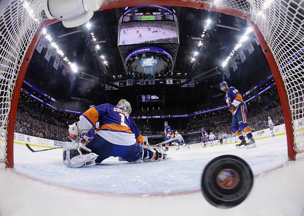 NEW YORK, NY - MAY 06: An overtime goal by Jason Garrison #5 of the Tampa Bay Lightning against Thomas Greiss #1 of the New York Islanders results in a 2-1 victory for the Lightning in Game Four of the Eastern Conference Second Round during the 2016 NHL Stanley Cup Playoffs at the Barclays Center on May 06, 2016 in the Brooklyn borough of New York City. (Photo by Bruce Bennett/Getty Images)